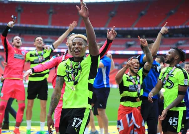 Huddersfield Town's Rajiv van La Parra celebrates with team-mates after winning the Sky Bet Championship play-off final at Wembley Stadium, London.