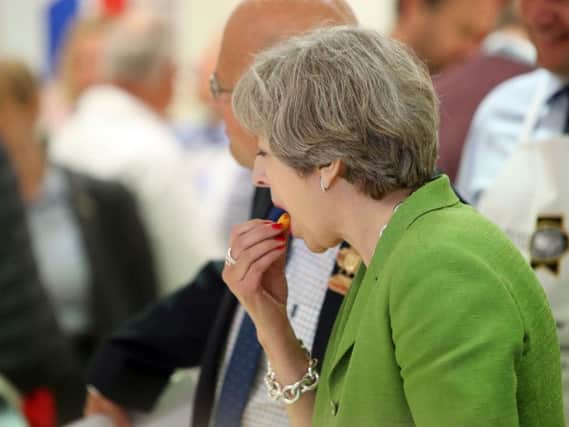 Prime Minister Theresa May during a General Election campaign visit to The Royal Bath and West Show near Shepton Mallet in Somerset. Picture: Steve Parsons/PA Wire