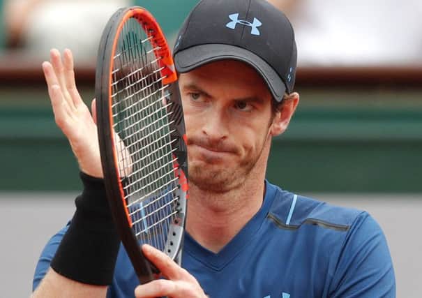 Britain's Andy Murray applauds as he plays Russia's Andrey Kuznetsov during their first round match the French Open tennis tournament at the Roland Garros stadium. (AP Photo/Christophe Ena)