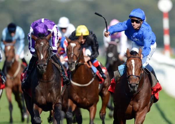 Mickael Barzalona and Encke celebrates after beating hot favourite Camelot and Joseph O Brien to win the Ladbrokes St Leger Stakes in 2012.