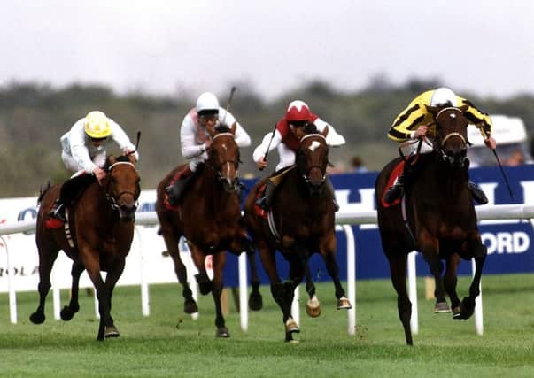 On a winner: George Duffield and User Friendly, far right, go on to win the St Leger at Doncaster in 1992 after their Oaks success. Picture: PA