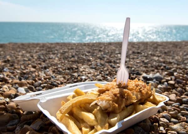 Delicious fish and Chips take away meal enjoyed on the beach