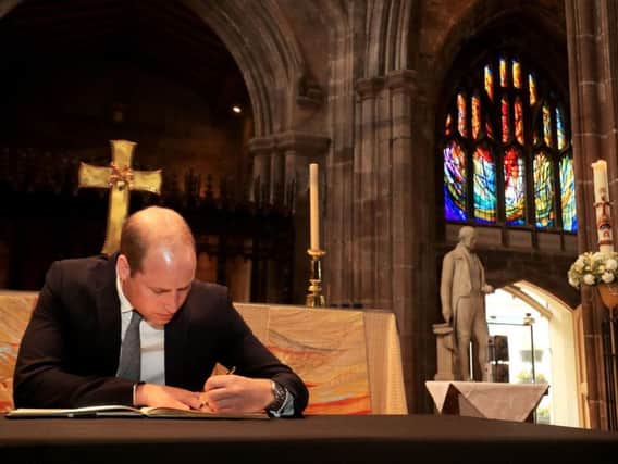 The Duke of Cambridge signs a book of condolence at Manchester Cathedral where he to met first responders and members of the local community who provided vital care and support to those affected by last week's suicide bomb attack, including representatives from St John's Ambulance, Northern Rail and the British Red Cross. Picture: Danny Lawson/PA Wire