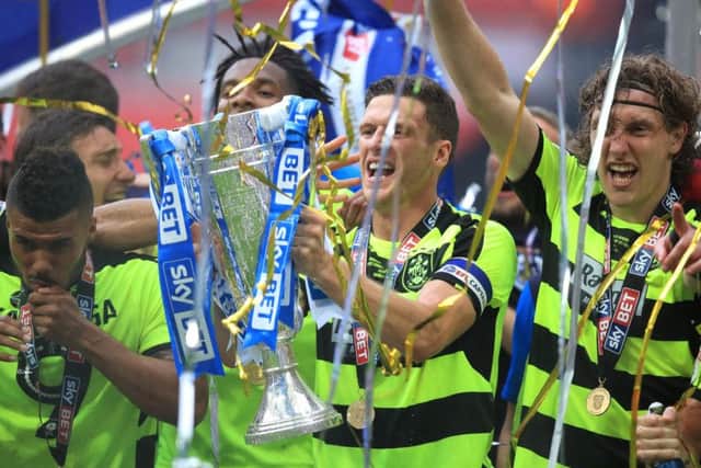 Huddersfield Town's Mark Hudson celebrates with the trophy after winning the Sky Bet Championship play-off final at Wembley Stadium, London. (Picture: Mike Egerton/PA Wire)