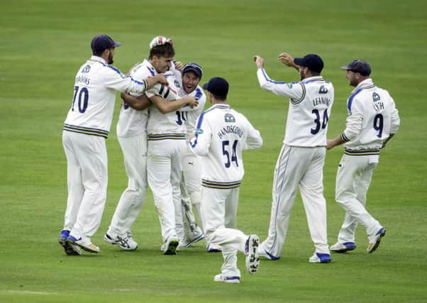 Yorkshires Ben Coad is congratulated by team-mates after taking the wicket of Lancashires Haseeb Hameed (Picture: Allan McKenzie/SWpix.com).