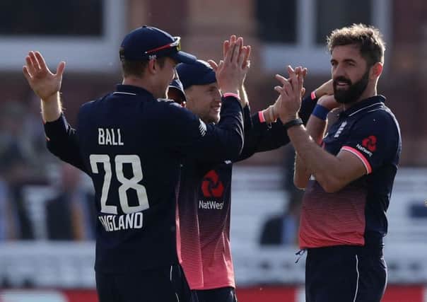 Liam Plunkett, right, wants to take wickets not just be part of Englands line-up to make the numbers up (Picture: PA).