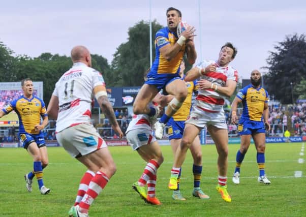 Joel Moon goes over for a Leeds try.