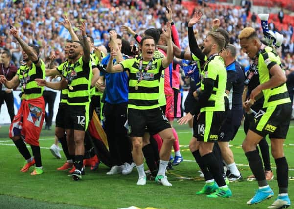 Huddersfield Town's Dean Whitehead celebrates with team-mates after winning the Sky Bet Championship play-off final at Wembley