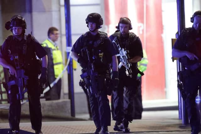 Armed police outside Monument station.