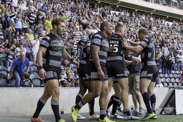 On the way: Hull FC celebrate Jamie Shaul's try against Wigan.