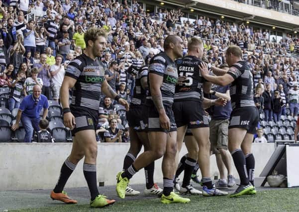 On the way: Hull FC celebrate Jamie Shaul's try against Wigan.