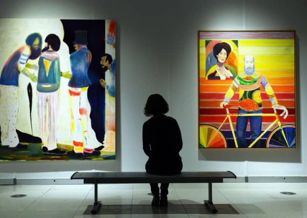 Curator Jeanine Griffin with works by Ryan Mosley. Picture by Scott Merrylees