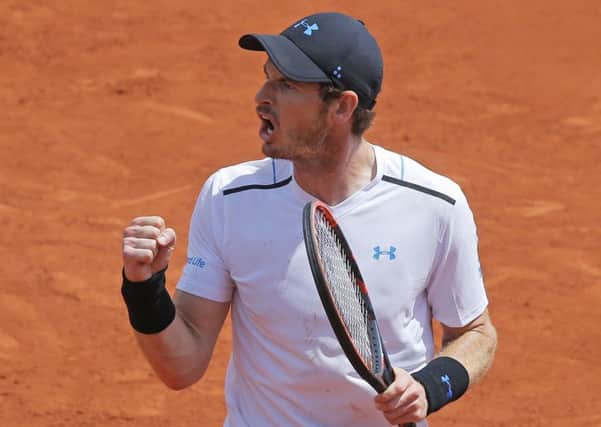 Britain's Andy Murray celebrates winning his fourth round win against Russia Karen Khachanov in three sets 6-3, 6-4, 6-4, at the French Open. (AP Photo/Michel Euler)