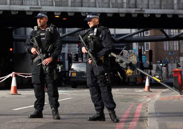 Armed police guard Borough Market, scene of Saturday's knife rampage.