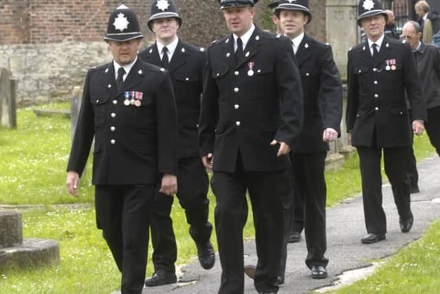 Police officers arrive at the memorial service to mark the 20th anniversary of the murder of Special Constable Glenn Goodman.  (120614M2d)