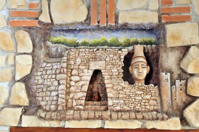 History lesson: A mural of the entrance to the Royal Palace of Ugarit, an ancient port city in Northern Syria, at the restaurant. Picture: Tony Johnson.