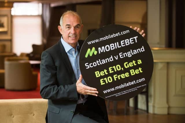 Former Morton, Leeds United, Manchester United and Milan striker, Joe Jordan promote online betting company Mobilebet and their odds on the Scotland v England clash on Saturday.

(Picture: Nick Ponty)