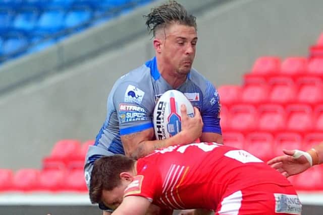 Wakefield Trinity's Chris Annakin is put under pressure by by the Salford defence. (Picture: Simon Hulme)