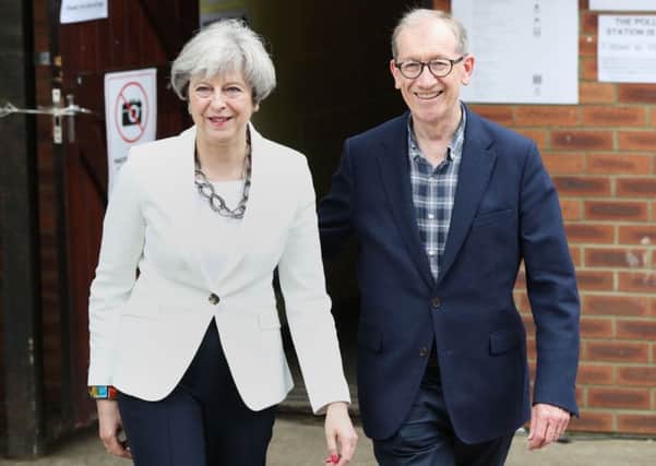 Prime Minister Theresa May and her husband Philip leave after casting their votes in the General Election at a polling station in the village of Sonning, Berkshire. PRESS ASSOCIATION Photo. Picture date: Thursday June 8, 2017. See PA story ELECTION Main. Photo credit should read: Jonathan Brady/PA Wire