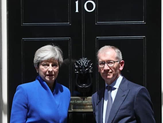 Prime Minister Theresa May, accompanied by her husband Philip, after making a  statement in Downing Street. Picture: Jonathan Brady/PA Wire