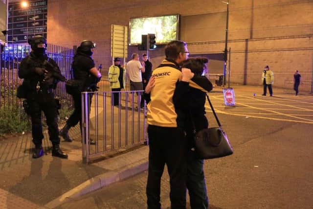 Armed police rushed to the scene of the bombing in Manchester