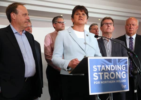 DUP leader Arlene Foster surrounded by her fellow DUP MPs