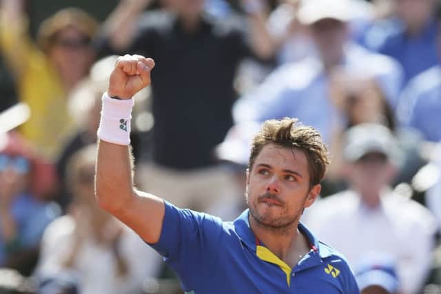 ROAD TO VICTORY: Stan Wawrinka clenches his fist as he wins the fourth set against Andy Murray. Picture: AP/David Vincent