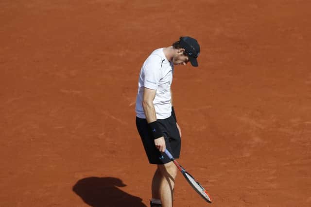 Britain's Andy Murray reacts after missing a return against Stan Wawrinka Picture: AP/Petr David Josek