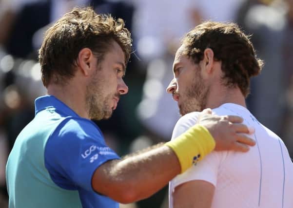 Stan Wawrinka, left, consoles Andy Murray after beating him in their French Open semi-final in paris on Friday afternoon. Picture: AP Photo/David Vincent