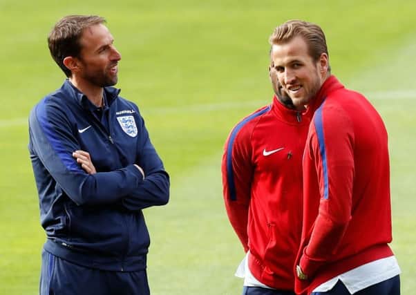 England manager Gareth Southgate talks to Harry Kane during a squad walk around at Hampden Park yesterday (Picture: Martin Rickett/PA Wire).