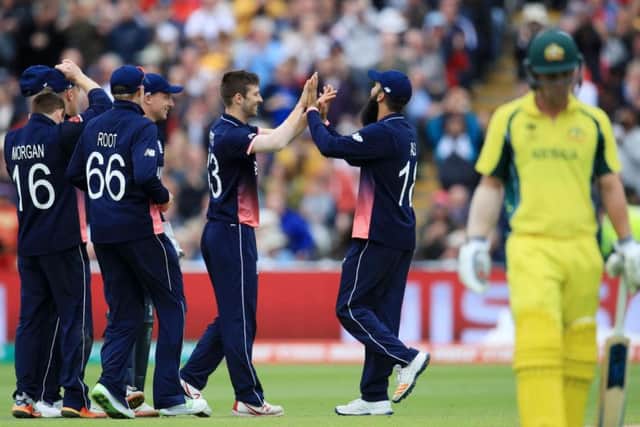 England seamer Mark Wood celebrates one of his four wickets
