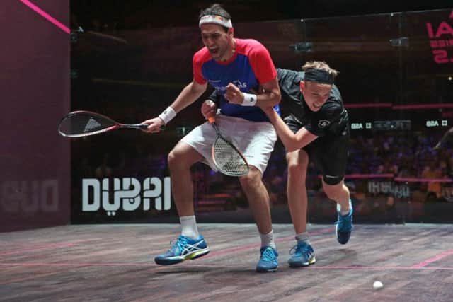 Mohamed ElShorbagy and James Willstrop collide during their World Series Finals showdown. Picture courtesy of PSA.