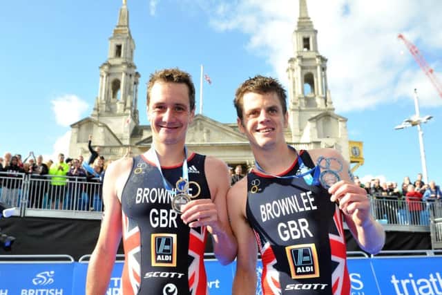 Winner Alistair Brownlee and runner-up, brother Jonny, with their medals after the World Triathlon Series race in their home-town, Leeds (Picture: Tony Johnson).