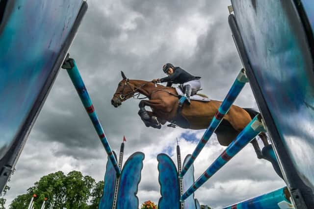 WINNER: Yoshiaki Oiwa, on Calle 44 leaps over one of the fences during showjumping section on Sunday. Picture: James Hardisty.