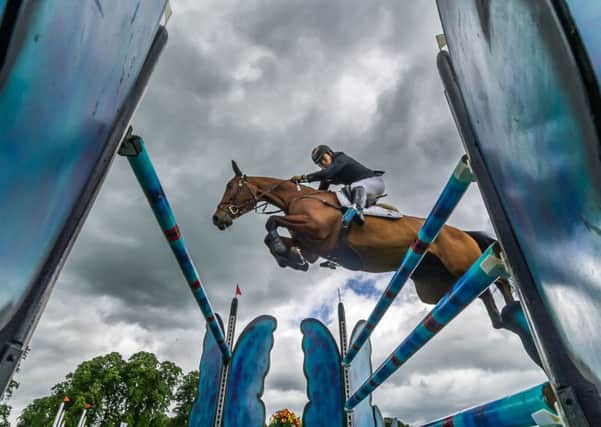 WINNER: Yoshiaki Oiwa, on Calle 44 leaps over one of the fences during showjumping section on Sunday. Picture: James Hardisty.