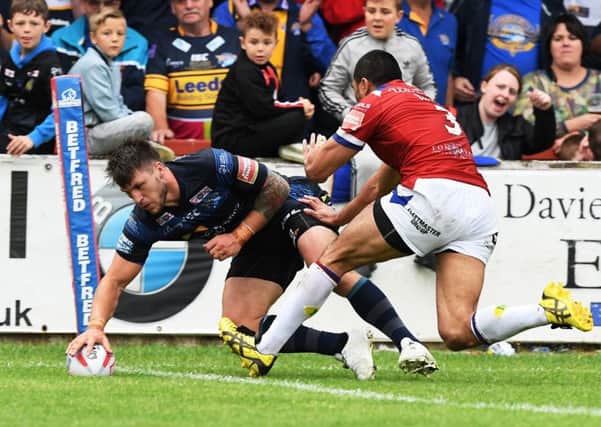 Tom Briscoe touches down for Leeds Rhinos' third try. against Wakefield Trinity. Picture: Bruce Rollinson