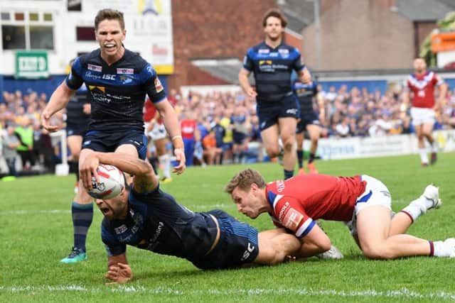 Joel Moon goes for the line to score Leeds Rhinos' fourth try against 
Wakefield Trinit. Picture: Bruce Rollinson