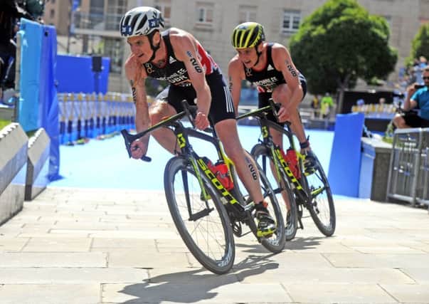 CATCH ME IF YOU CAN: 
Jonny Brownlee leads his brother Alistair on the bike in the Elite Men's Triathlon Race through Leeds' Millennium Square. Picture: Tony Johnson.