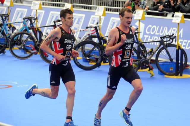 Alistair Brownlee with brother Jonny on the run in the Elite Men's Triathlon Race in Leeds. Picture: Tony Johnson.