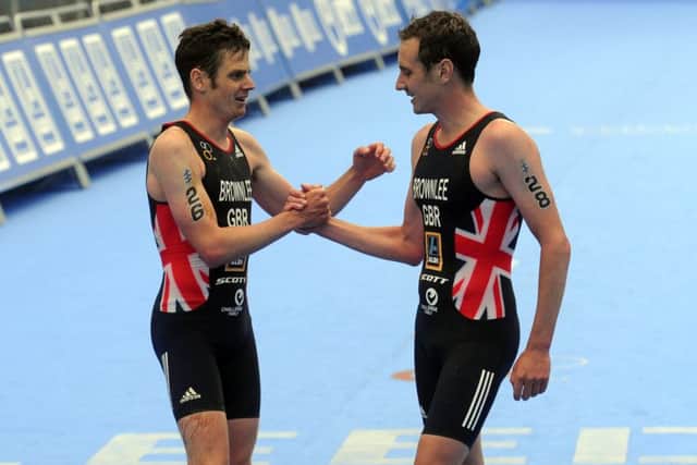 Jonny Brownlee congratulates his brother Alistair winning the Elite Men's Race. Picture: Tony Johnson.