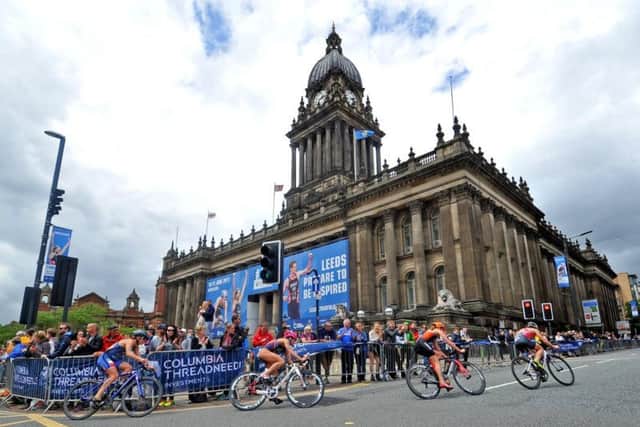 The Elite Womens Race pass Leeds Town Hall. Picture: Tony Johnson.