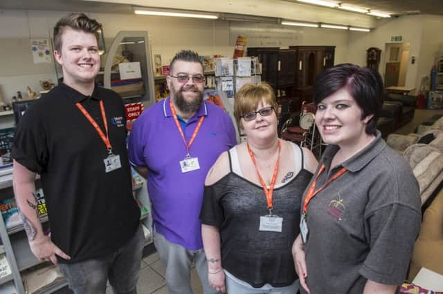 Rotherham Hospice volunteer Andy Rhodes, with wife Cheryl, son Ashley and daughter Lucy who all help out at the Maltby shop