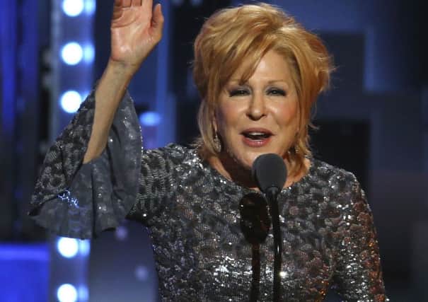 Bette Midler accepts the award for best performance by an actress in a leading role in a musical for "Hello, Dolly!"