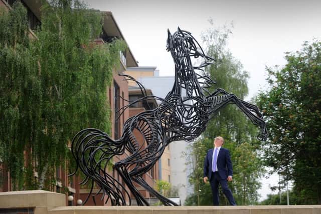 Russell Galley   looks up at the Lloyds Black Horse Sculpture, at Lovell Park, Leeds.
 Picture by Simon Hulme