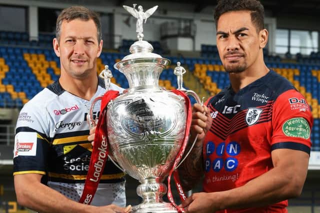 Leeds Rhinos Captian Danny McGuire and Featherstone Rovers Captain Misi Taulapapa with the Ladbrokes Challenge Cup Trophy ahead of Friday night's quarter-final match.  Picture Bruce Rollinson
