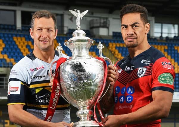 Leeds Rhinos Captian Danny McGuire and Featherstone Rovers Captain Misi Taulapapa with the Ladbrokes Challenge Cup Trophy ahead of Friday night's quarter-final match.  Picture Bruce Rollinson