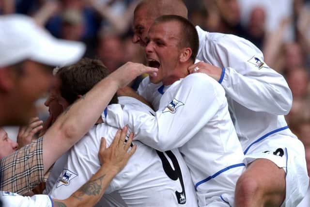 Leeds players celebrate Alan Smith's goal against Newcastle in 2003