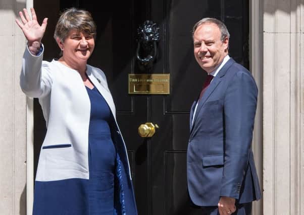 DUP leader Arlene Foster and DUP deputy leader Nigel Dodds arriving at Number 10 for talks on a deal to prop up a Tory minority administration. (PA).