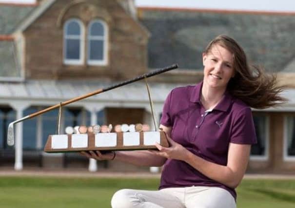 Rotherham GC's Olivia Winning with the Helen Holm Scottish women's open stroke play championship trophy at Royal Troon last year.