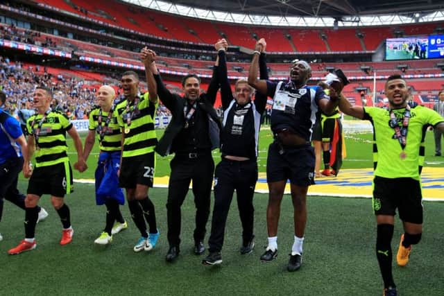 Huddersfield Town celebrate after winning the Championship play-off final at Wembley last month. Picture: Mike Egerton/PA